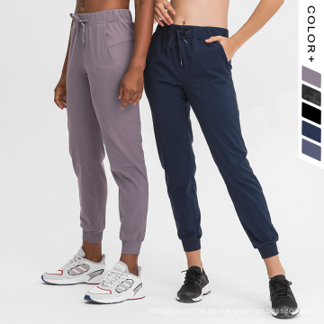 Pantalones de joggadores para mujeres Sportswear 4 vías Pantalones elásticos Pantalones de atletismo delgados Pantalones livianos Pantalones de chándal